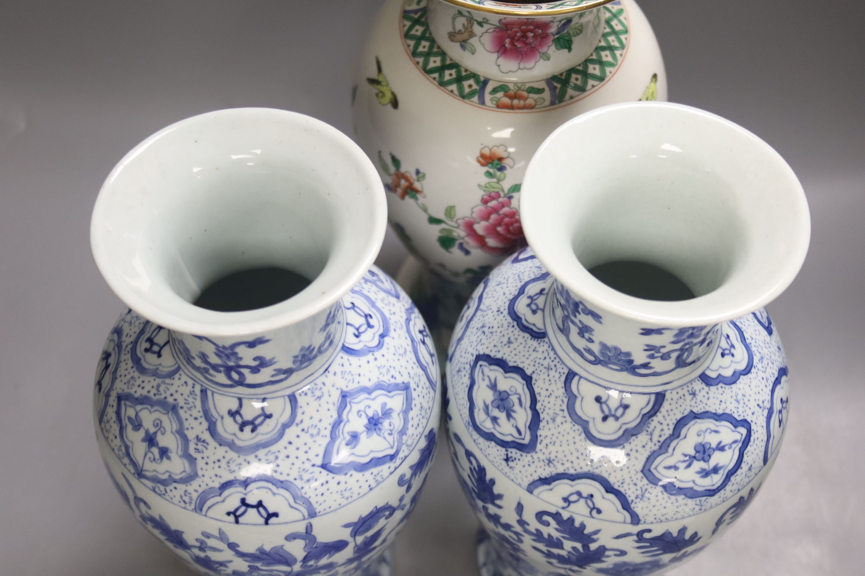 A pair of blue and white Chinese vases, height 31cm, and two others